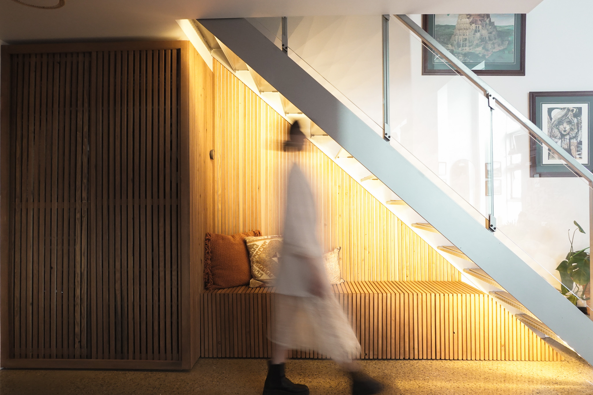 Sunlit minimalist interior with a low table and ceramic vessels